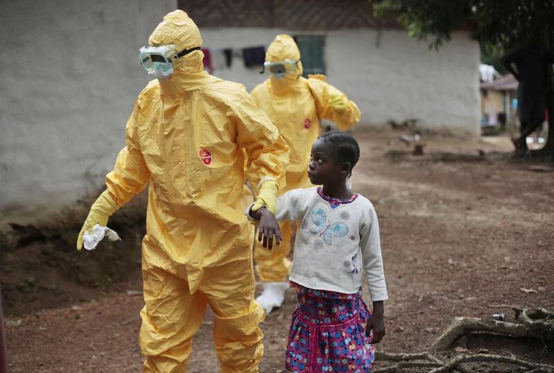 Nowa Paye, 9, is taken to an ambulance after showing signs of the Ebola. Aid donations are still inadequate, as the international community tries to increase the ability to care for the spiralling number of people with the disease that has hit Liberia the hardest. 