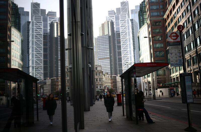 London's financial district. Figures show an expansion for the UK's services sector and a slower contraction for manufacturing. Reuters