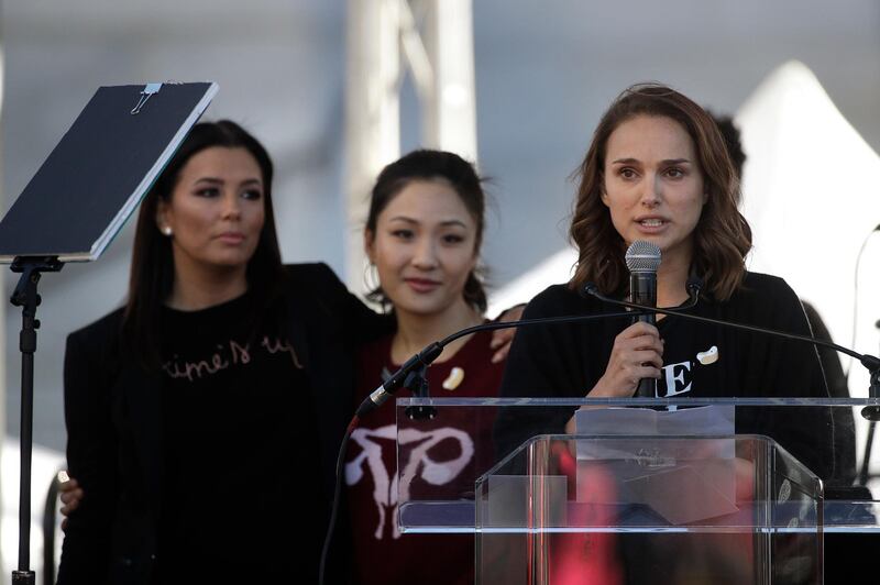 Actress Natalie Portman, right, speaks as she is joined by Eva Longoria, background left, and Constance Wu at a Women's March against sexual violence and the policies of the Trump administration in Los Angeles. Jae C Hon/ AP photo