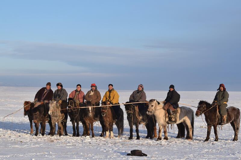 Rangers are in Winter. For the Mongolian long lasting cold winter ranging from minus 20 to 40 celsus Rangers of the Hustai National Park Trust riding horse for daily activity.
