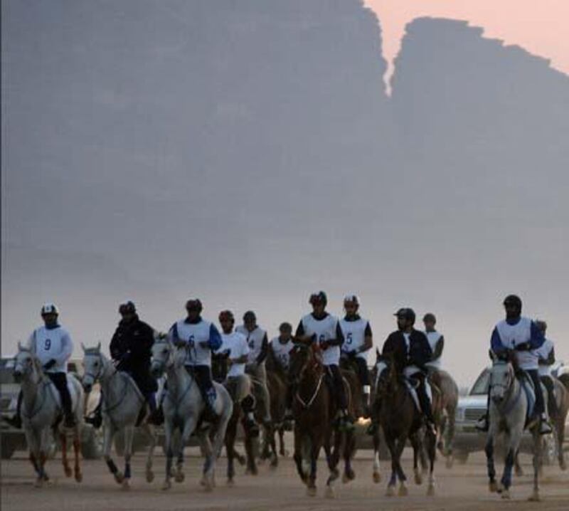 Jockeys compete with their horses in the Wadi Rum International Endurance Ride in the Jordanian desert on November 14, 2008. Dubai ruler Sheikh Mohammed bin Rashed al-Maktoum, who is also Emirati vice president and prime minister, won the 120-km race. AFP PHOTO/AWAD AWAD *** Local Caption ***  707840-01-08.jpg