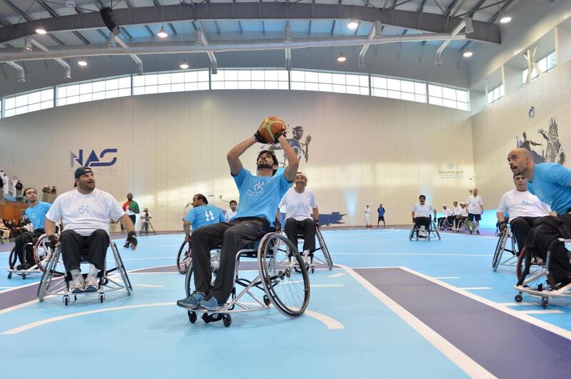Sheikh Hamdan bin Mohammed, the Crown Prince of Dubai,, centre, took part in a friendly match between a Dubai government team and the UAE national wheelchair basketball team on April 16, 2014. Courtesy Government of Dubai Media Office