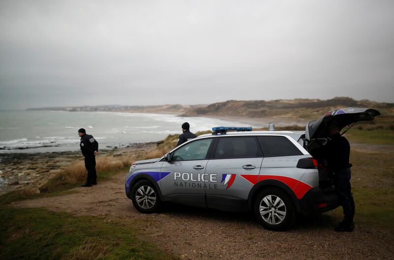 French police patrol at the coast, near Calais. Rescue workers have pulled migrants from the Channel after a boat capsized. Reuters