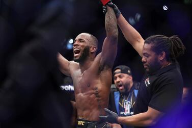 Leon Edwards celebrates his victory over Kamaru Usman in the the welterweight title bout at the UFC 286 mixed martial arts event Saturday, March 18, 2023, in London.  (Kieran Cleeves / PA via AP)