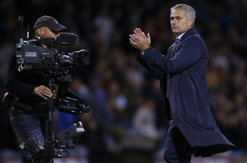 Chelsea manager Jose Mourinho applauds after their Premier League season opening win over Burnley on Monday night. Andrew Yates / Reuters 