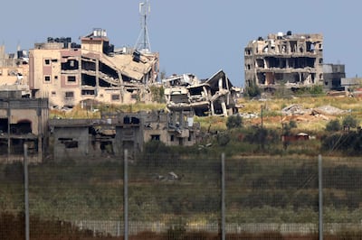 Badly damaged buildings in Gaza as seen from across the border fence with Israel. AFP 