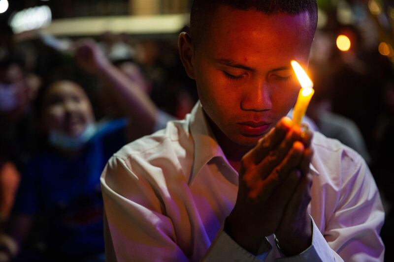 Thai mourners attend a candlelight vigil for the victims of the Terminal 21 Mall shooting on February 9, 2020 in KORAT, Thailand. Getty Images