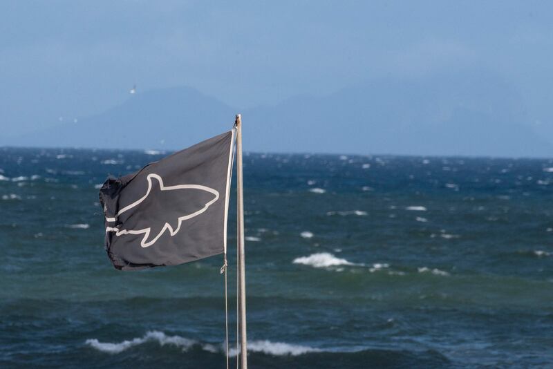 A shark warning flag at Muizenberg Beach, near Cape Town, South Africa. Attacks on humans are reported to be rare. AFP