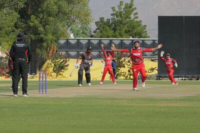 Oman bowler Bilal Khan appeals for the wicket of UAE batsman Basil Hameed on Sunday. Courtesy Cricket Oman