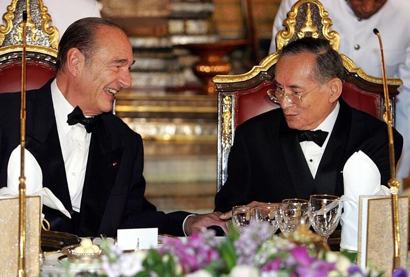 Then French president Jacques Chirac, left, speaking to the Thai king at a gala dinner at the Royal Palace in Bangkok on February 17, 2006. Remy de la Mauviniere / AFP