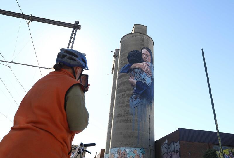 MELBOURNE, AUSTRALIA - MAY 23: A mural painted by artist, Loretta Lizzio is seen on a silo in the suburb of Bruswick on May 23, 2019 in Melbourne, Australia. AUD$11,000 was crowd-funded to commission Lizzio to paint the iconic image of Jacinda Ardern embracing a Muslim in the aftermath of the 2019 Christchurch mosque attacks that killed 50 people. (Photo by Robert Cianflone/Getty Images)