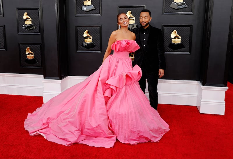 Chrissy Teigen and John Legend arrive for the 64th annual Grammy Awards at the MGM Grand Garden Arena in Las Vegas, Nevada, US, on April 3, 2022. EPA