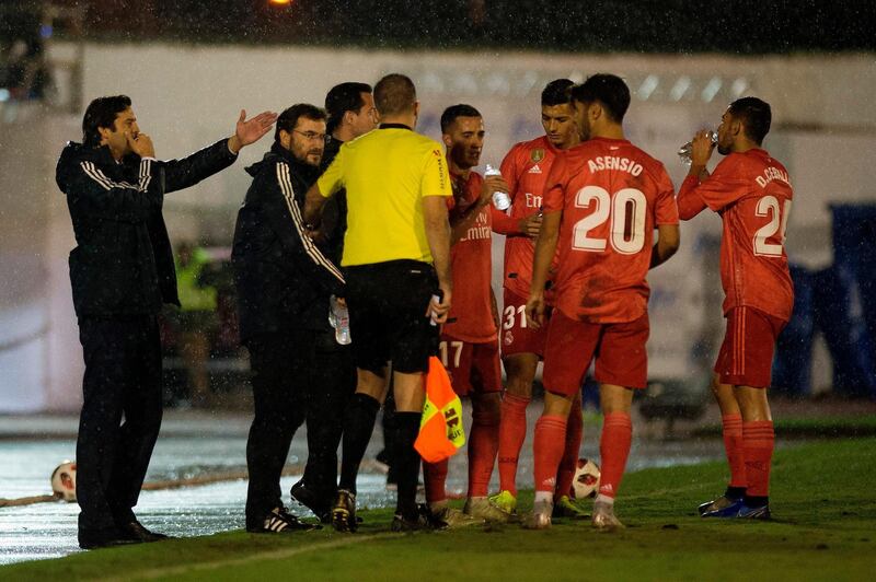 Real Madrid coach Santiago Solari gestures as his players drink during the Spanish King's Cup match against UD Melilla. AFP