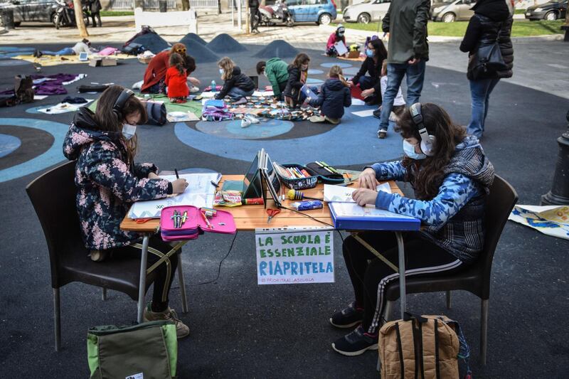 Students take part in outdoor lessons to protest against distance learning in Milan, Italy. EPA