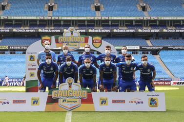 PORTO ALEGRE, BRAZIL - MARCH 15: Grêmio players pose for photo before a match between Gremio and Sao Luiz as part of the Rio Grande do Sul State Championship 2020, to be played behind closed doors at Arena do Gremio Stadium, on March 15, 2020 in Porto Alegre, Brazil. The Government of the State of Rio Grande do Sul issued a list of new guidelines to help prevent the spread of the Coronavirus which included games played with closed doors and no public. According to the Ministry of Health, as of Saturday, March 14, Brazil had 121 confirmed cases of coronavirus. (Photo by Lucas Uebel/Getty Images)