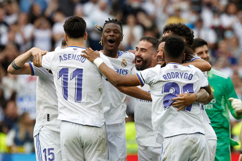 Real Madrid's Marco Asensio, Rodrygo, Eduardo Camavinga and teammates celebrate after winning La Liga with a 4-0 victory against Espanyol. Reuters