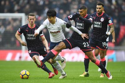 epa06577627 Tottenham's Heung-Min Son t(2L) vies with Huddersfield's Collin Quaner (2R)  defence during the English Premier League soccer match Tottrenham vs Huddersfield at Wembley Stadium in London, Britain, 03 March 2018.  EPA/ANDY RAIN EDITORIAL USE ONLY. No use with unauthorized audio, video, data, fixture lists, club/league logos or 'live' services. Online in-match use limited to 75 images, no video emulation. No use in betting, games or single club/league/player publications
