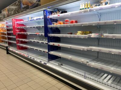 Empty shelves from a Sainsbury's supermarket in London, UK, as shoppers in the British capital stockpile goods in advance of strict lockdown measures to fight coronavirus. Emma Sky for The National