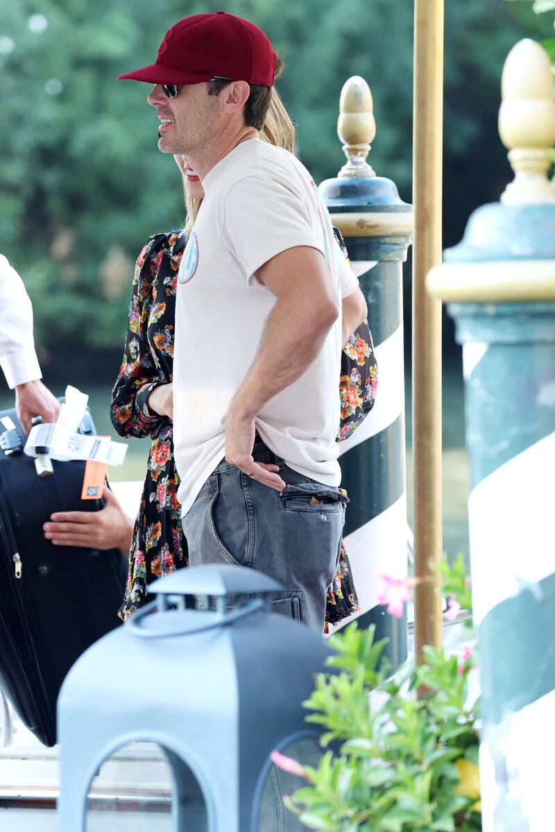 While others dressed up, Casey Affleck arrives at the Hotel Excelsior in jeans, T-shirt and a baseball cap. Getty