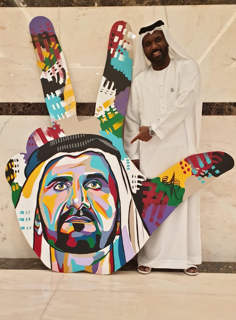 Khalfan with one of his three-finger paintings