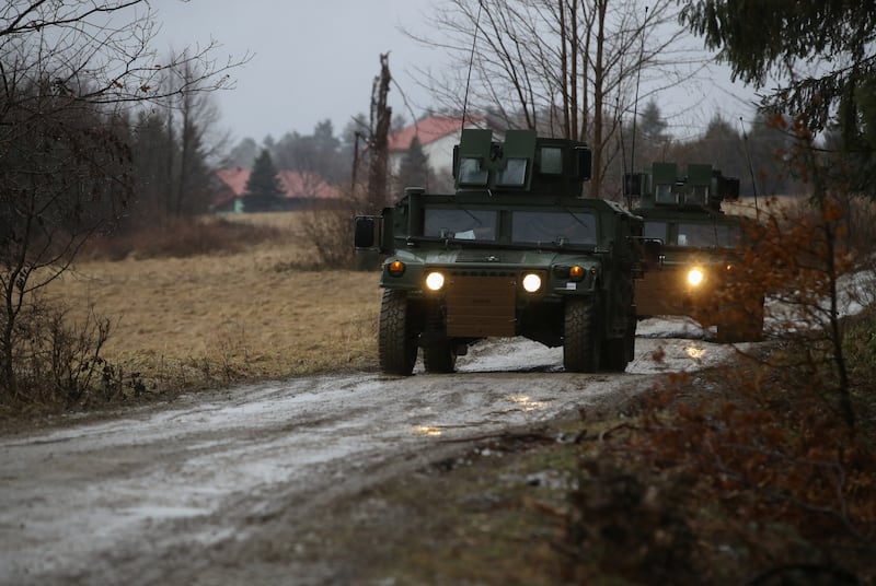 US Army soldiers from the 82nd Airborne Division head towards an air base near Arlamow, Poland. Reuters