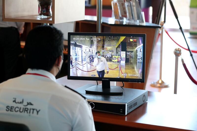 Dubai, United Arab Emirates - Reporter: N/A. News. Coronavirus/Covid-19. A security guard monitors visitors temperatures at Times Square in Dubai. Tuesday, October 20th, 2020. Dubai. Chris Whiteoak / The National