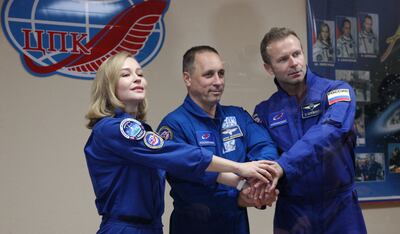 Cosmonaut Anton Shkaplerov (centre), actress Yulia Peresild and film director Klim Shipenko are blasting off to space to film scenes at the ISS. AFP