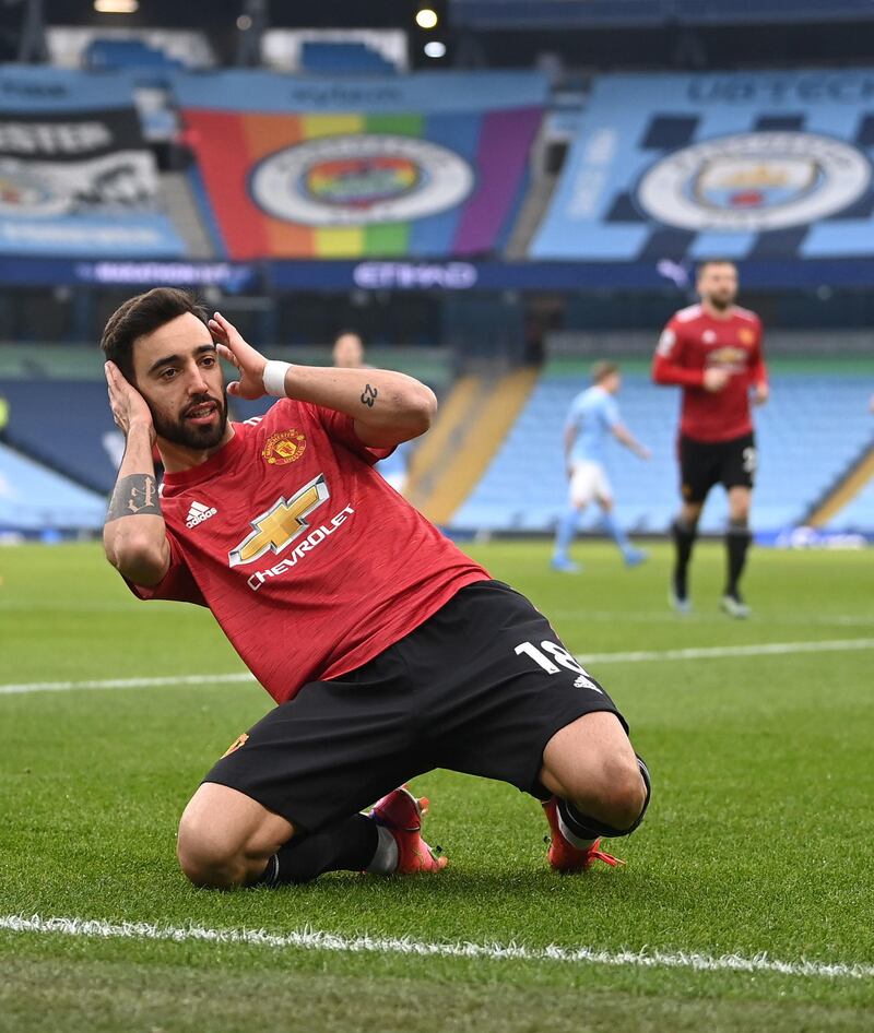 Manchester United's Bruno Fernandes celebrates scoring their side's first goal of the game during the Premier League match at the Etihad Stadium, Manchester. Picture date: Sunday March 7, 2021. PA Photo. See PA story SOCCER Man City. Photo credit should read: Laurence Griffiths/PA Wire.RESTRICTIONS: EDITORIAL USE ONLY No use with unauthorised audio, video, data, fixture lists, club/league logos or "live" services. Online in-match use limited to 120 images, no video emulation. No use in betting, games or single club/league/player publications.