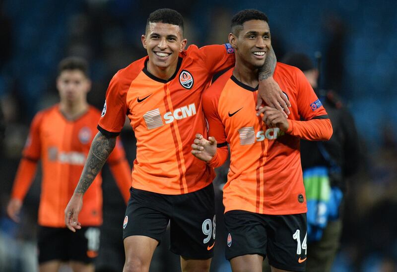 Shakhtar Donetsk's Tete and Dodo (L) greet supporters at the end of the match. EPA