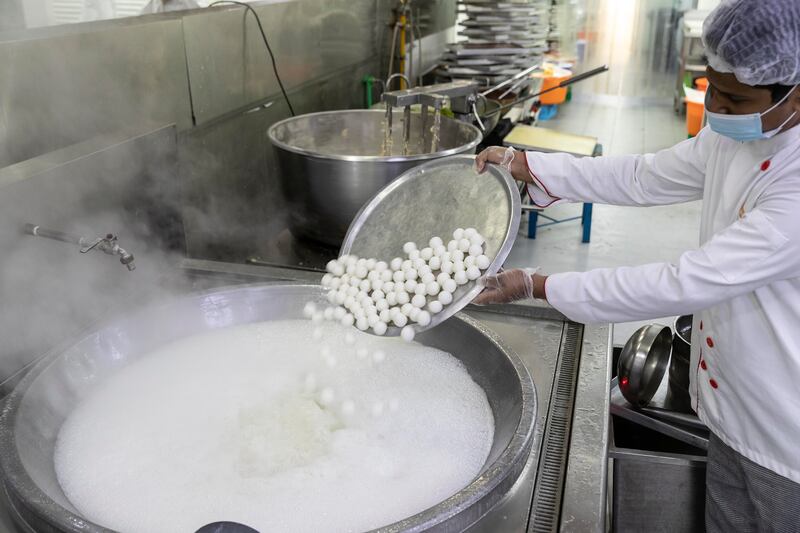 Workers start bright and early at 6am to produce tasty treats for the Hindu festival of light. 

