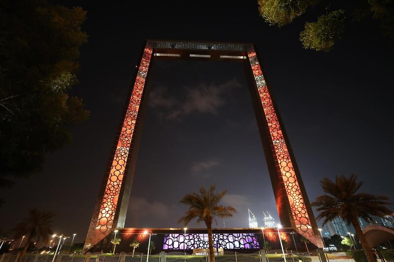 DUBAI, UNITED ARAB EMIRATES , November 18 – 2020 :- Dubai Frame light up in the colors of Omani flag to celebrate the 50th National Day in Dubai. (Pawan Singh / The National) For News/Standalone/Big Picture/Online/Instagram