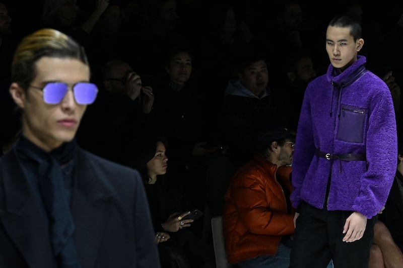 Mirrored aviator glasses and leather utility belts at Emporio Armani. AFP