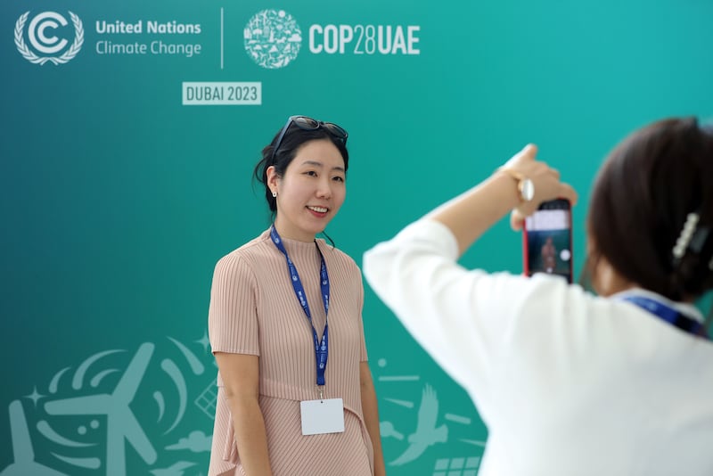 A visitor recording the moment at Cop28. Chris Whiteoak / The National