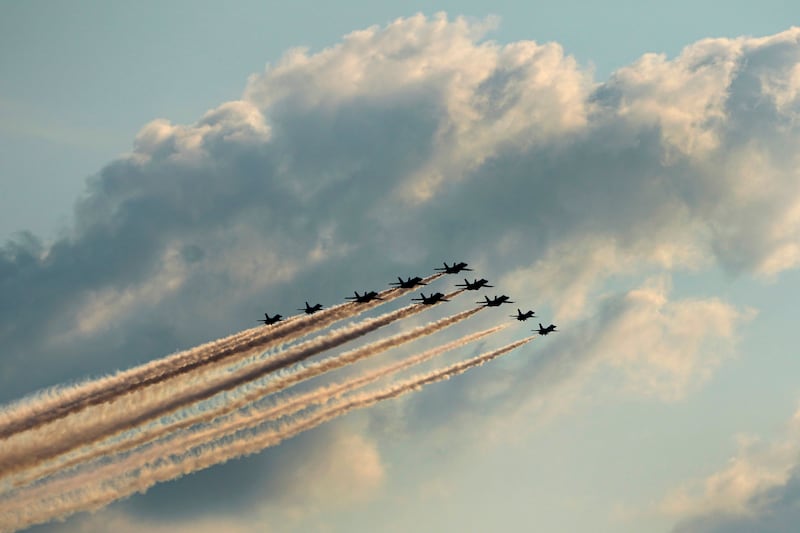 Members of the US Air Force Thunderbirds and the Blue Angels fly over Kansas City, Missouri. AP
