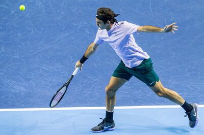 Switzerland's Roger Federer returns a shot to Belgium's David Goffin during their semifinal match at the Swiss Indoors tennis tournament at the St. Jakobshalle in Basel, Switzerland, on Saturday, Oct. 28, 2017. (Alexandra Wey/Keystone via AP)