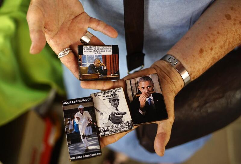 An artisan sells refrigerator magnets with images of Barack Obama in  Havana. Ramon Espinosa / AP Photo