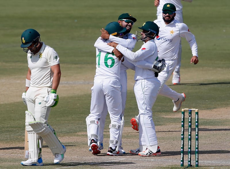 Pakistan's Mohammad Rizwan is congratulated by teammates after catching out South Africa batsman Dean Elgar. AP