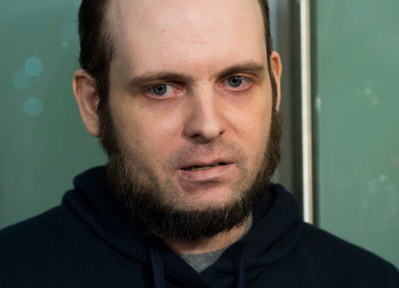 FILE- In this Oct. 31, 2017, file photo, Joshua Boyle speaks to the media after arriving at the Pearson International Airport in Toronto. A lawyer for Boyle, a Canadian man recently freed with his American wife and children after years of being held hostage in Afghanistan, says his client has been arrested and faces at least a dozen charges including sexual assault.
Attorney Eric Granger said Tuesday, Jan. 2, 2017, that Boyle also faces assault and forcible confinement charges. (Nathan Denette/The Canadian Press via AP)