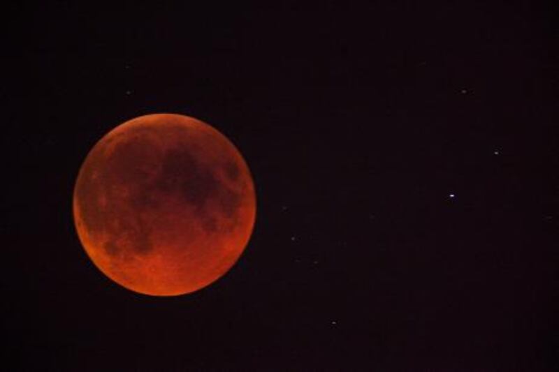 Thursday, June 16 2011 - 00:23 - A full moon glows red as it is eclipsed by the Earths shadow seen from Dubai, United Arab Emirates. Pawel Dwulit  /The National