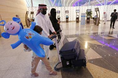 Saudi passengers enter King Abdulaziz International Airport in Jeddah, Saudi Arabia. AP