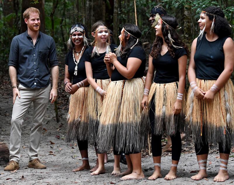 Britain's Prince Harry, left, the Duke of Sussex, meets with members of the Butchulla people. EPA