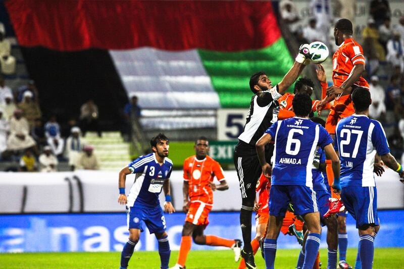 Dubai, UAE, December 5 2012: 

Al Nasr and FC Dibba battled it out tonight at the Maktoum Stadium. Unfortunately neither side had much to celebrate as the teams ended the match in a 1-1 draw.

Seen here is Al Nasr's goalkeeper going up for the ball.

Lee Hoagland/The National