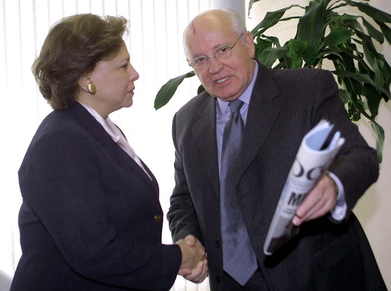 Former Soviet president Mr Gorbachev shakes hands with UN official and former Egyptian minister Mervat Tallawy at the UN head office in Beirut in April 2003. Mr Gorbachev called on the US and Britain to end the "bloodbath" in Iraq and allow the UN to resolve the crisis. AFP 