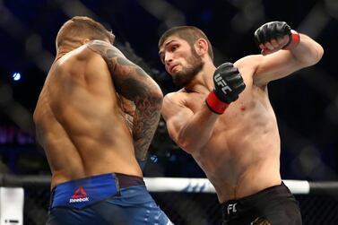 Khabib Nurmagomedov, right, during his win over Dustin Poirier at UFC 242 in Abu Dhabi. AP 