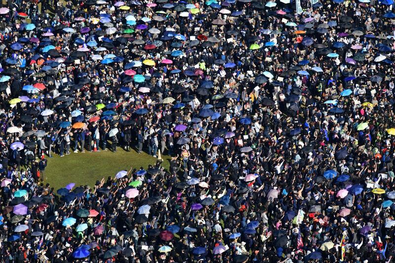 People gather at Victoria Park for a pro-democracy rally in Hong Kong.  Democracy protesters are hoping for huge crowds December 8 at a rally they have billed as a "last chance".  AFP
