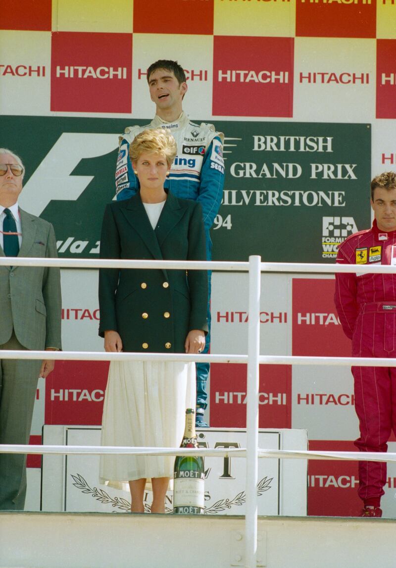 SILVERSTONE - JULY 10:  Williams-Renault driver Damon Hill (centre, top) of England stands on the podium with Princess Diana after he won the British Formula One Grand Prix held on July 10, 1994 at Silverstone, England. (Photo by Getty Images)
