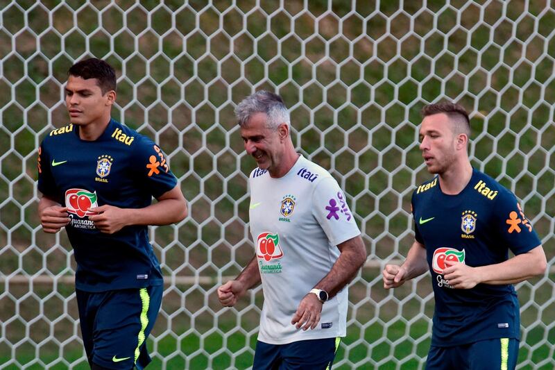 Brazil players Thiago Silva, left, and Arthur are put through their paces. AFP