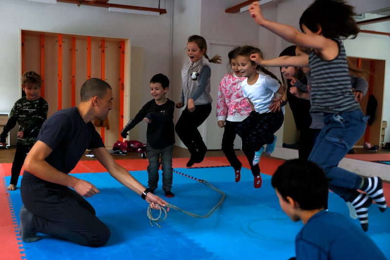 Children attend a physical education class at Spilno School in Kyiv. Getty