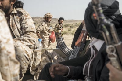 Ahmed Omar ( L) with other members of Yemeni resistance forces of Abu Jabr brigade that have been defending their areas against Houthi advances in Zi Naem town of Al-Bayda governorate,  May 8, 2018.  Photo/ Asmaa Waguih 