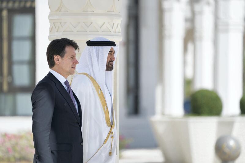 ABU DHABI, UNITED ARAB EMIRATES - November 15, 2018: HH Sheikh Mohamed bin Zayed Al Nahyan Crown Prince of Abu Dhabi Deputy Supreme Commander of the UAE Armed Forces (R) and HE Giuseppe Conte, Prime Minister of Italy (L), stand for the national anthem, during a reception held at the Presidential Palace.

( Mohamed Al Hammadi / Ministry of Presidential Affairs )
---